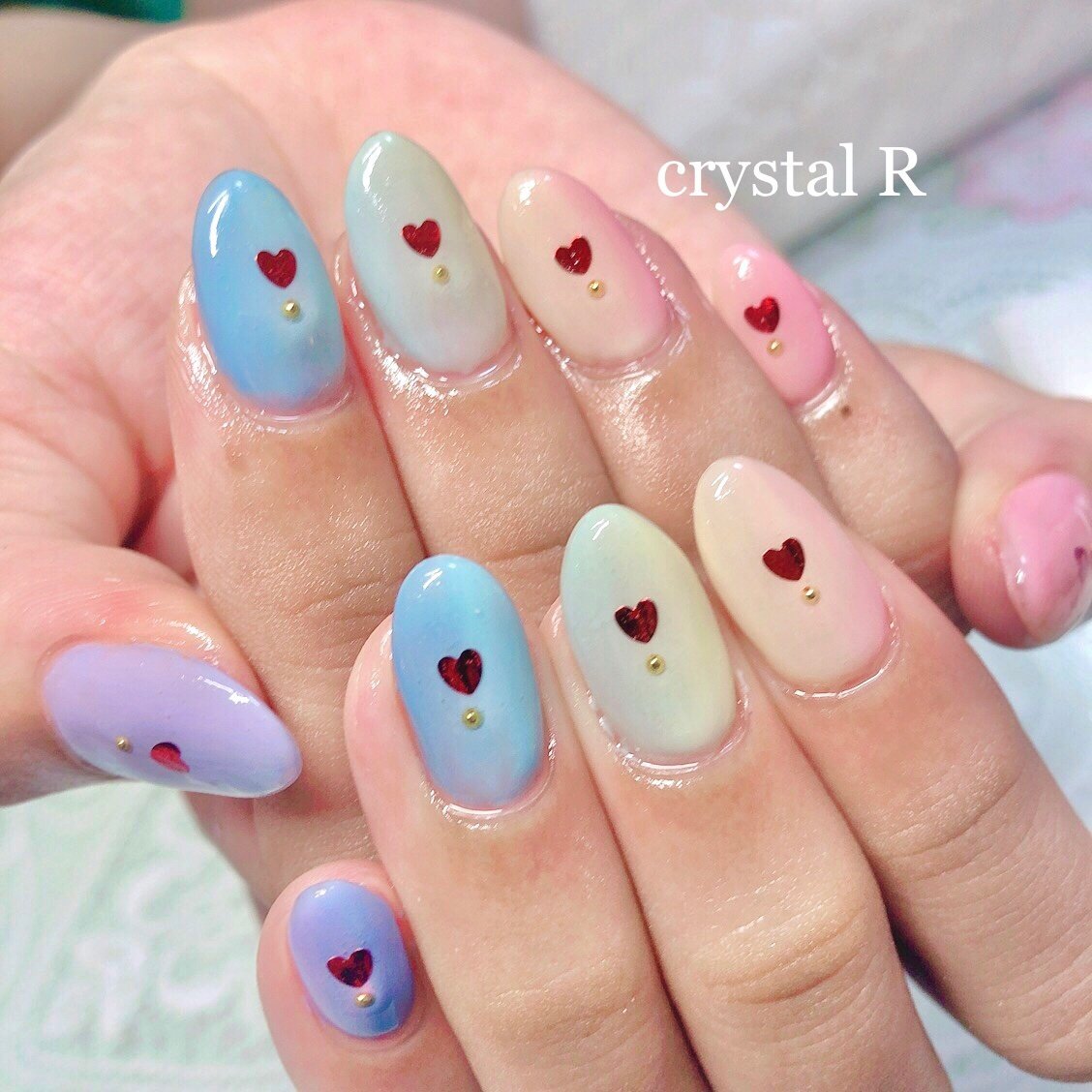 ピンク イエロー 水色 Crystal R Nail Salon のネイルデザイン No ネイルブック