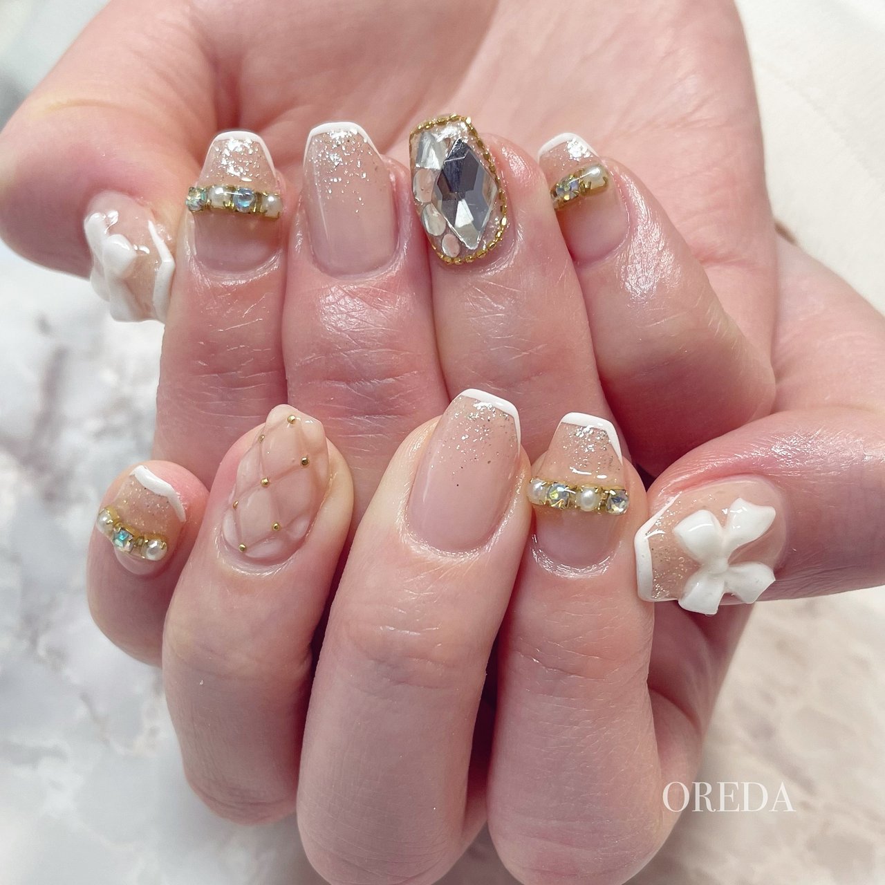 フレンチ ビジュー ラメ リボン キルティング Oreda Nailsalonのネイルデザイン No ネイルブック