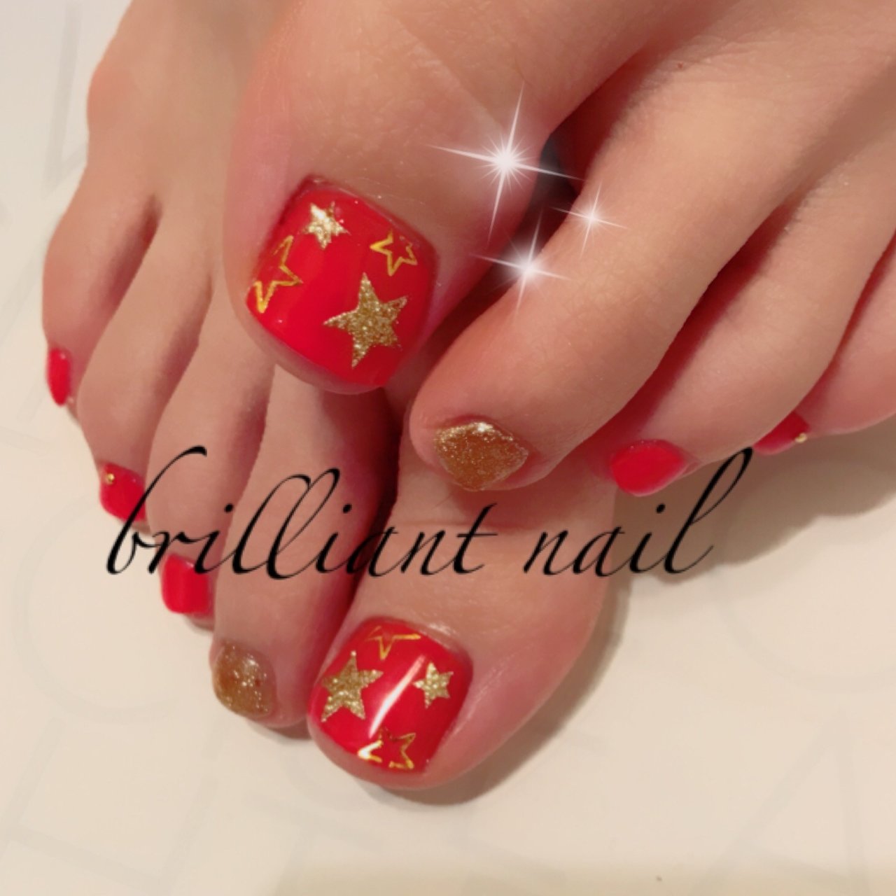 夏フット星オレンジジェル Brilliantnailのネイルデザインno